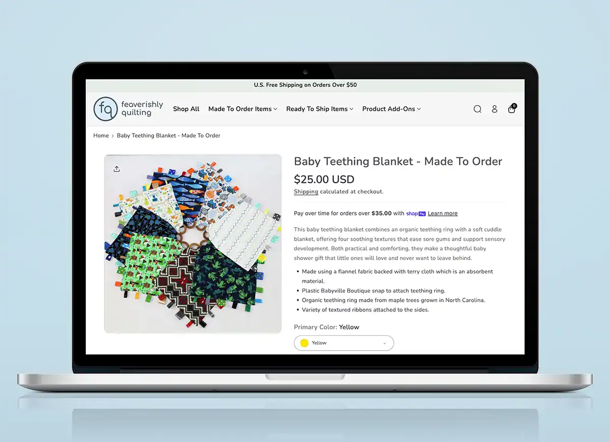 Feaverishly Quilting Shopify product page on laptop featuring handmade baby teething blanket product details