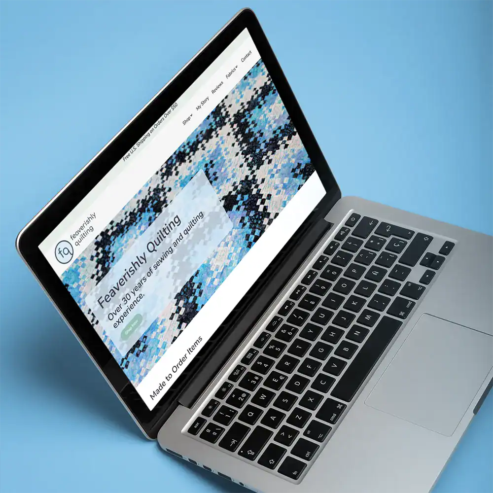 Feaverishly Quilting WordPress website homepage displayed on laptop highlighting quilting brand and content-driven design