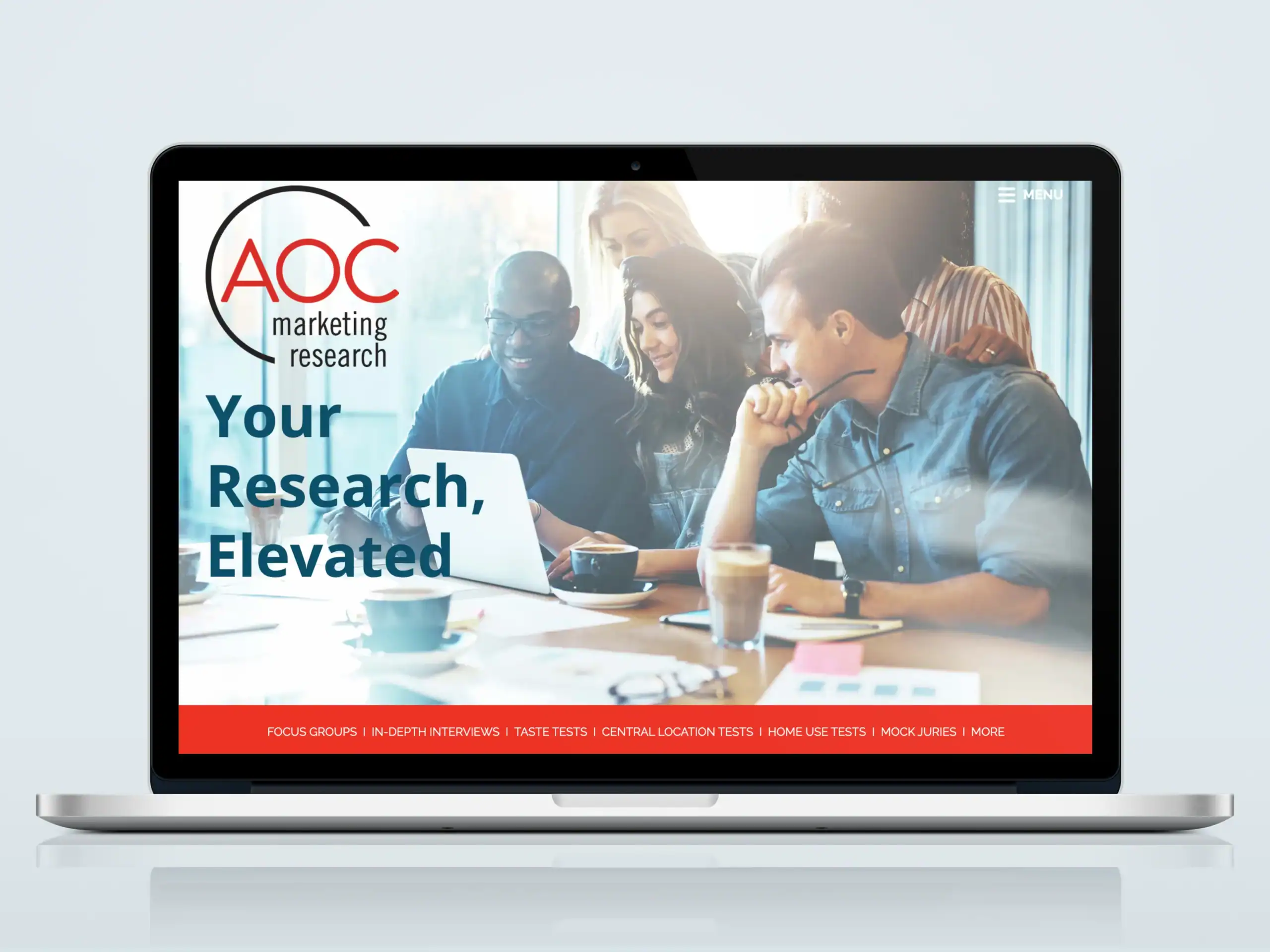 AOC Marketing Research website homepage displayed on laptop