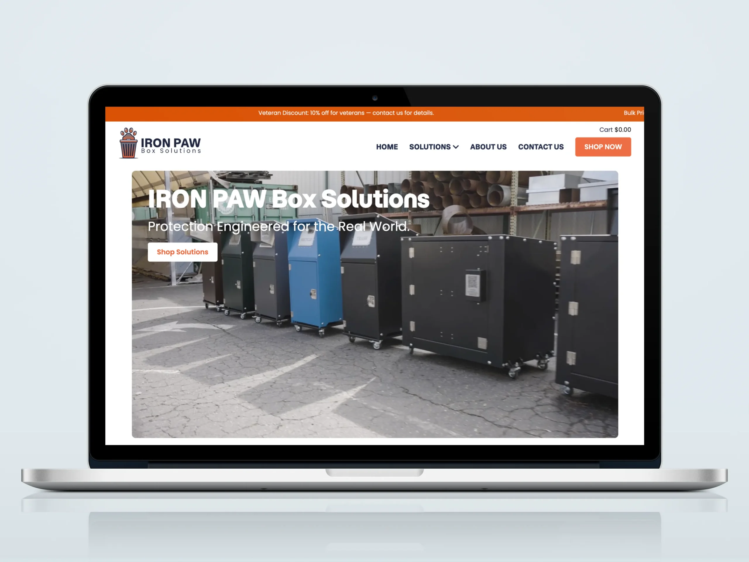Iron Paw Box Solutions website homepage displayed on laptop