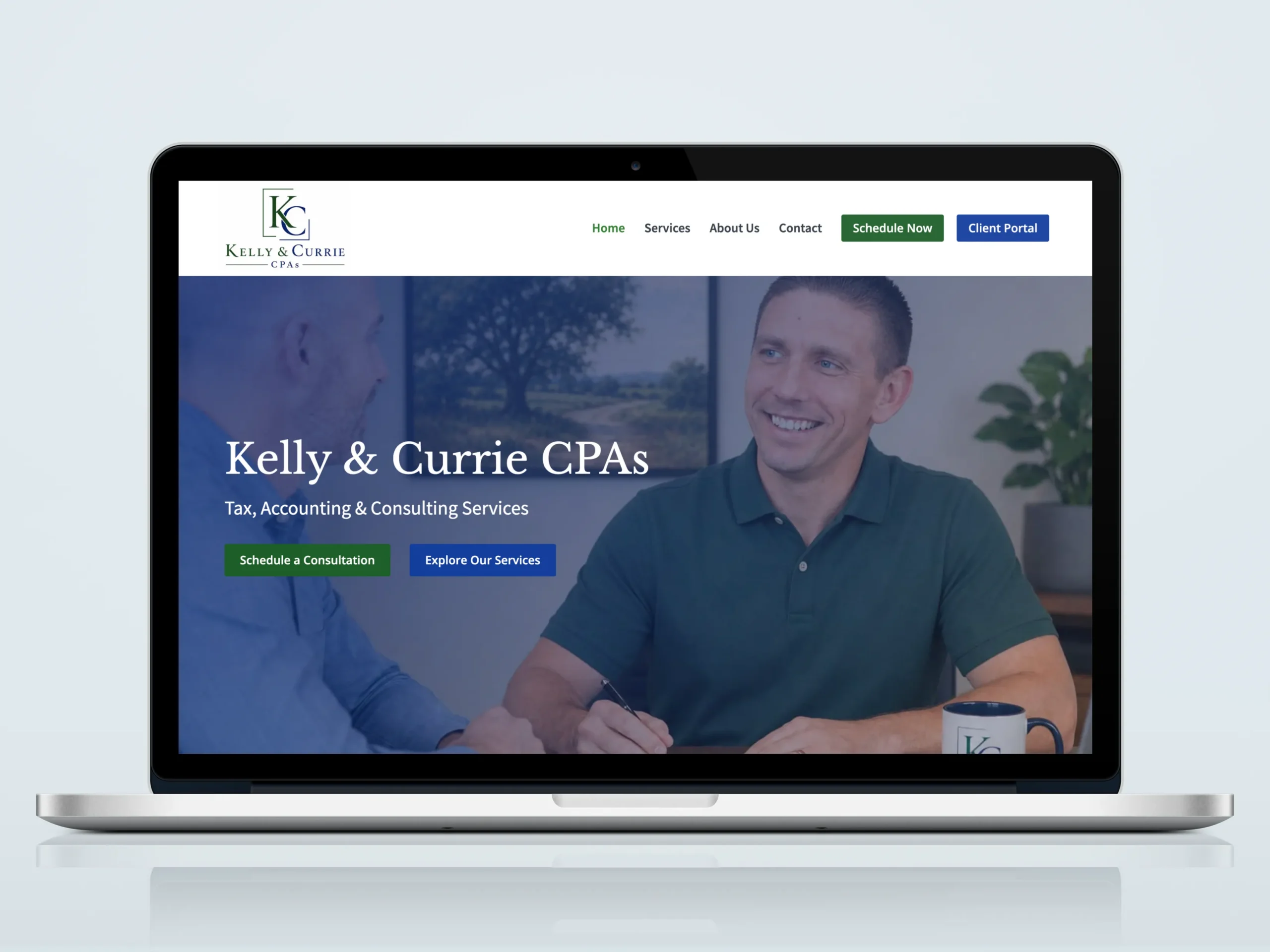 Kelly & Currie CPAs website homepage displayed on laptop
