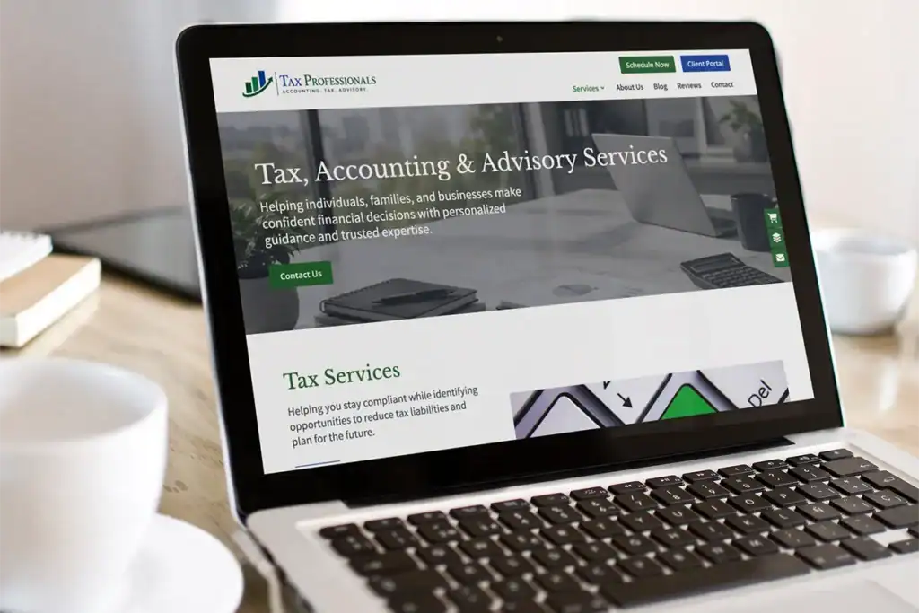 Laptop displaying a professional tax services website with clearly organized accounting, tax preparation, bookkeeping, and consulting services.