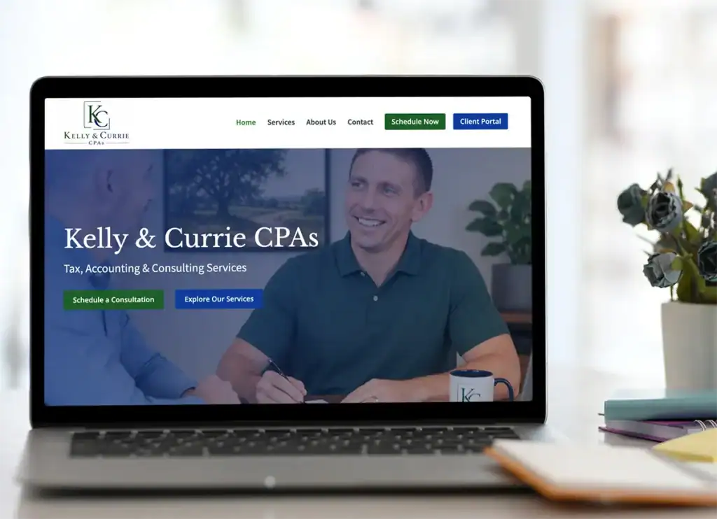 Kelly & Currie CPAs website displayed on a laptop with a call to action promoting custom WordPress website design by AJT Digital Designs.