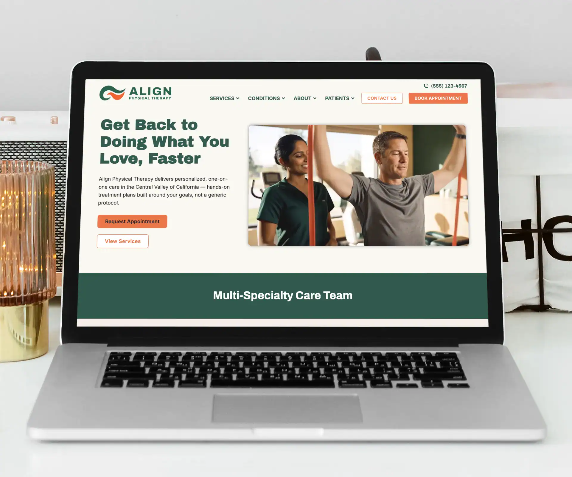 Laptop screen showing the Align Physical Therapy website template homepage, featuring a therapist-patient hero image in a forest green and orange design.
