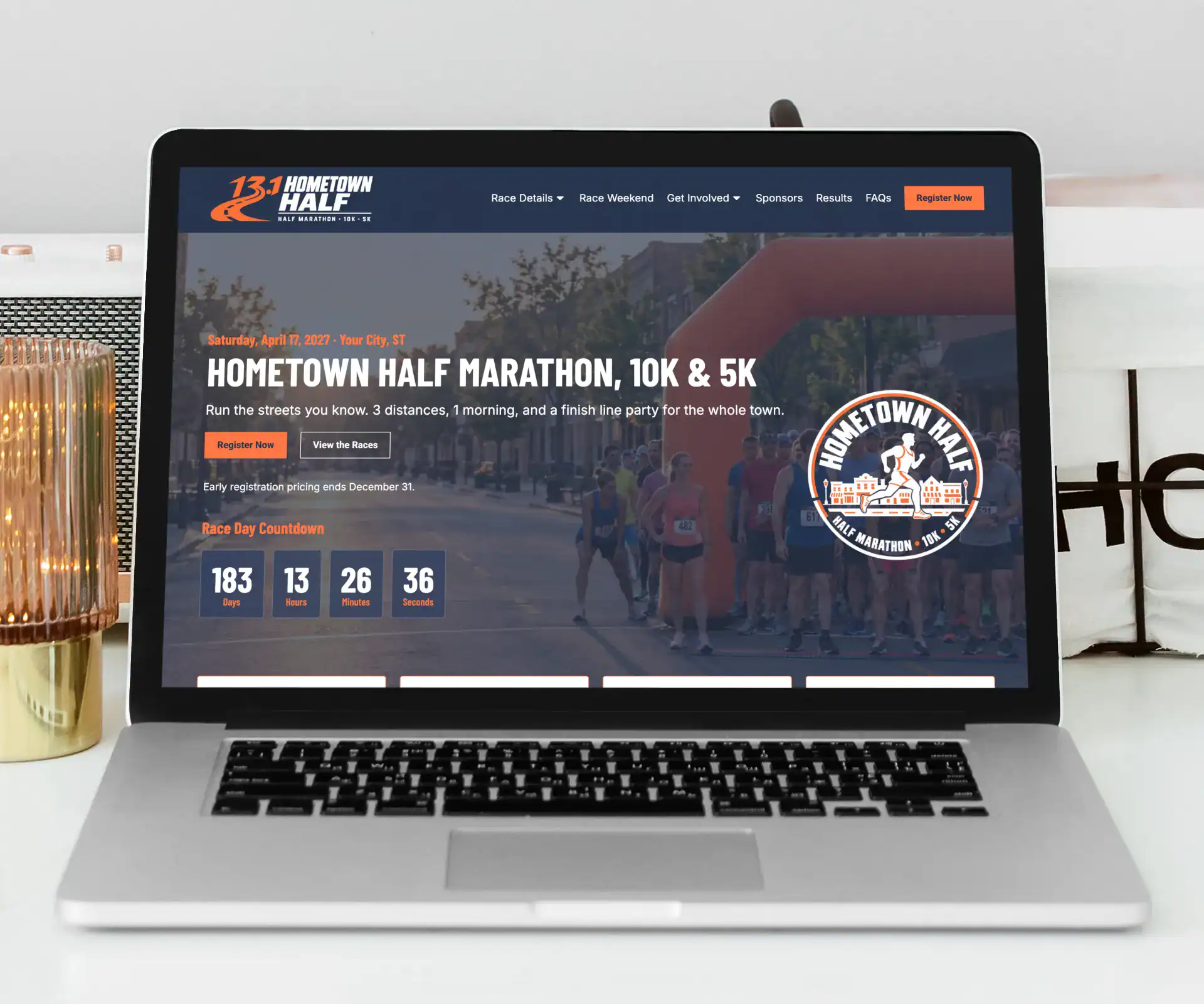 running event website template homepage shown on a laptop
